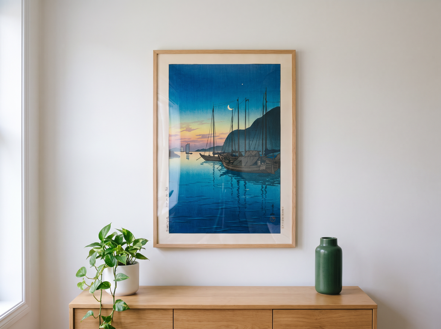 A Mystery Box poster framed in a Kuriosis oak frame above a sideboard
