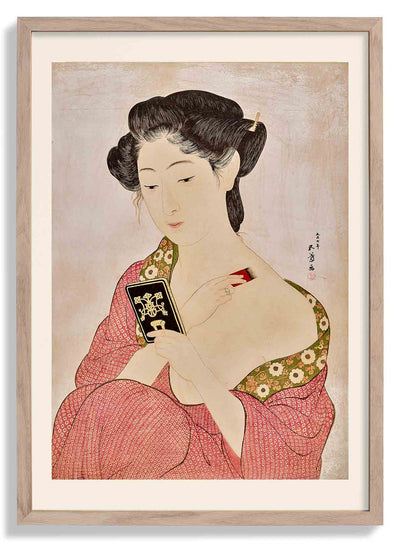 Woman applying powder by Gōyo Hashiguchi