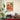 Woman with cat in living room with warm earth tones by Caroline Bonne Müller - Kuriosis Fine Art GmbH