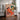 Woman with cat in living room with warm earth tones by Caroline Bonne Müller - Kuriosis Fine Art GmbH