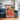 Woman with cat in living room with warm earth tones by Caroline Bonne Müller - Kuriosis Fine Art GmbH